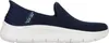 A side view of a navy blue Skechers slip-on sneaker with a white sole. Produktbild-Vorschau