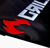 A close-up of a black fabric with a red flame logo and the word 'GRILL' in silver letters. Produktbild-Vorschau