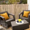 A balcony setting with two chairs, a coffee table, and a bamboo privacy screen. Podgląd zdjęcia produktu