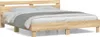 A wooden bed frame with a headboard and bedding, shown against a white background. Voir les images du produit