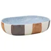 A multi-colored oval ceramic sink is shown against a white background. Produktbild-Vorschau