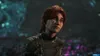 A close-up of a woman with red hair, looking slightly upwards with a concerned expression. She is wearing a dark uniform with gold accents. The background is blurred and appears to be an alien or fantasy landscape with glowing flora. Produktbild-Vorschau