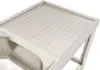A close-up view of a stainless steel sink with a textured drainboard. Náhled obrázku produktu