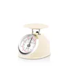 A retro-style analog kitchen scale is shown against a white background. Voir les images du produit