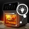 A close-up shot of a black air fryer with a roast chicken and croissants inside, with a graphic overlay of a lightbulb. Produktbild-Vorschau