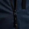 A close-up shot of a dark blue jacket zipper. Produktbild-Vorschau