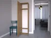A hallway with a chair and a cabinet. Náhled obrázku produktu