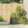 A garden scene with a planter and a chair. Produktbild-Vorschau