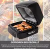 An open air fryer grill with cooked chicken wings inside, set against a collage of food images. Produktbild-Vorschau