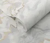 A roll of wallpaper with a marble pattern and gold accents. Produktbild-Vorschau