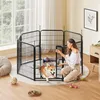 A woman is interacting with a dog inside a black metal pet playpen. Produktbild-Vorschau