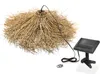 A solar-powered hanging lamp with a natural, boho-style shade and a separate solar panel. Produktbild-Vorschau