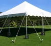 A white tent is set up on a green lawn with trees in the background. Produktbild-Vorschau