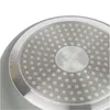 Close-up of the bottom of a frying pan, showing the textured surface and a circular logo. Náhľad obrázku produktu