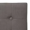 Close-up of a tufted gray fabric with a button. Podgląd zdjęcia produktu