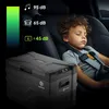 A young boy sleeps in a car seat next to a portable cooler. Anteprima dell’immagine prodotto