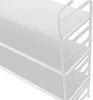 A close-up view of a white modular wall shelf unit. Voir les images du produit