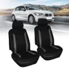Two black car seat covers with gray accents are displayed in front of a blurred image of a white car driving on a road. Produktbild-Vorschau