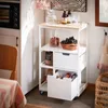 A kitchen cart filled with food items and drinks, placed in a kitchen setting. Náhled obrázku produktu