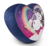 A heart-shaped pillow with a unicorn and rainbow design on a white background. Produktbild-Vorschau