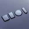 Four different shaped screen protectors are laid out on a dark, reflective surface. Produktbild-Vorschau