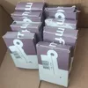 A cardboard box filled with multiple small purple product boxes. Produktbild-Vorschau