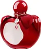 A red apple-shaped perfume bottle with a white label and a red and white striped string. Produktbild-Vorschau