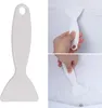 A collage of images showing a white plastic ice scraper being used to remove ice from a refrigerator or freezer. Produktbild-Vorschau