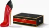 A red stiletto heel perfume bottle and its black and red box packaging are displayed on a white background. Produktbild-Vorschau