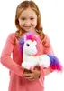 A young girl is holding a stuffed unicorn. Produktbild-Vorschau