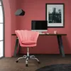 A pink velvet office chair is placed in front of a desk with a computer and a framed picture on a pink wall. Náhľad obrázku produktu