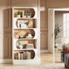 A modern white bookshelf filled with decorative items and books, placed in a well-lit room with a doorway and a side table with a lamp visible. Produktbild-Vorschau