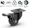 A black caster wheel with a braking mechanism, shown from a low angle against a white background. Above the wheel are icons and text describing its features. Voir les images du produit