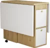 A closed folding dining table with storage drawers and drop-leaf extensions, shown from a slight diagonal angle. Produktbild-Vorschau
