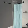 A shower curtain rod with a light blue shower curtain hanging from it, installed in a bathroom. Podgląd zdjęcia produktu