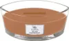 A WoodWick Santal Myrrh scented candle in a clear glass oval-shaped container with a wooden wick. Podgląd zdjęcia produktu