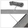 A close-up view of a grey and white striped balcony privacy screen, showing a grommet and a zip tie securing it to a pole. Produktbild-Vorschau