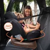 A woman is buckling a child into a car seat in the back seat of a car. Produktbild-Vorschau