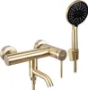 A gold-colored bathroom faucet and showerhead set against a white background. Anteprima dell’immagine prodotto