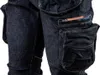 Close-up of dark blue denim jeans with multiple pockets. Podgląd zdjęcia produktu