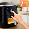 A hand is shown interacting with the digital display of a black air fryer on a kitchen counter. Náhled obrázku produktu
