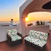 Outdoor patio furniture cushions on a balcony overlooking the ocean at sunset. Produktbild-Vorschau