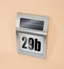 A solar-powered house number light with the number '29b' displayed. Produktbild-Vorschau