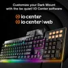 A close-up, angled view of a gaming keyboard with RGB lighting, set against a dark, textured background. Text overlays promote customization software. Produktbild-Vorschau