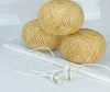 Three woven bamboo pendant light shades are arranged on a white surface with their white cords and sockets in the foreground. Produktbild-Vorschau