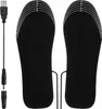 A pair of black heated insoles with a USB charging cable and adapter. Náhled obrázku produktu