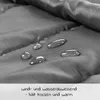 Close-up of fabric with water droplets, indicating water-repellent properties. Náhled obrázku produktu