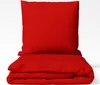 A red pillow and folded red duvet cover are displayed on a white background. Produktbild-Vorschau