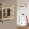 A hand holding a smartphone displaying a smart home app interface, next to a white electric towel warmer with a towel on it. Produktbild-Vorschau