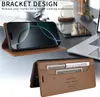 A desk with a laptop, phone case, and other office items. Produktbild-Vorschau
